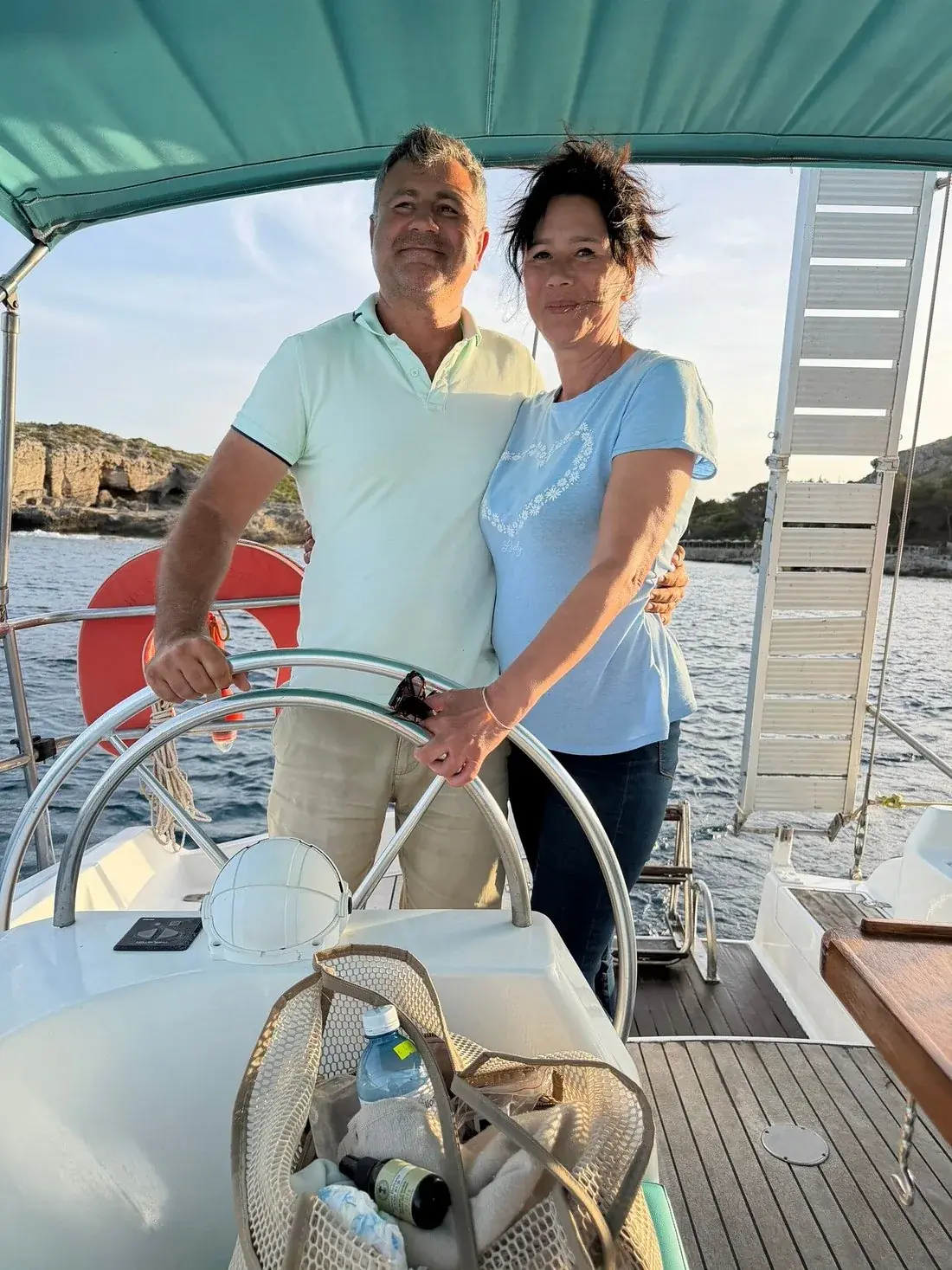 Simi and Flori at the wheel of sailing yacht Nikolaos
